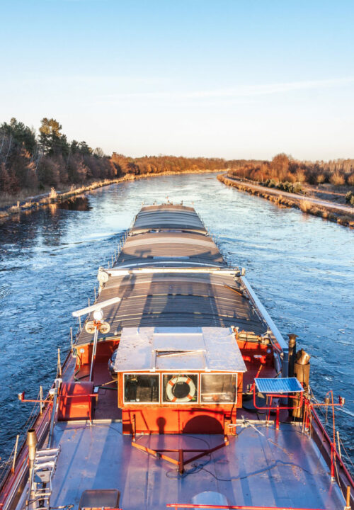 inland vessel drives a canal river along